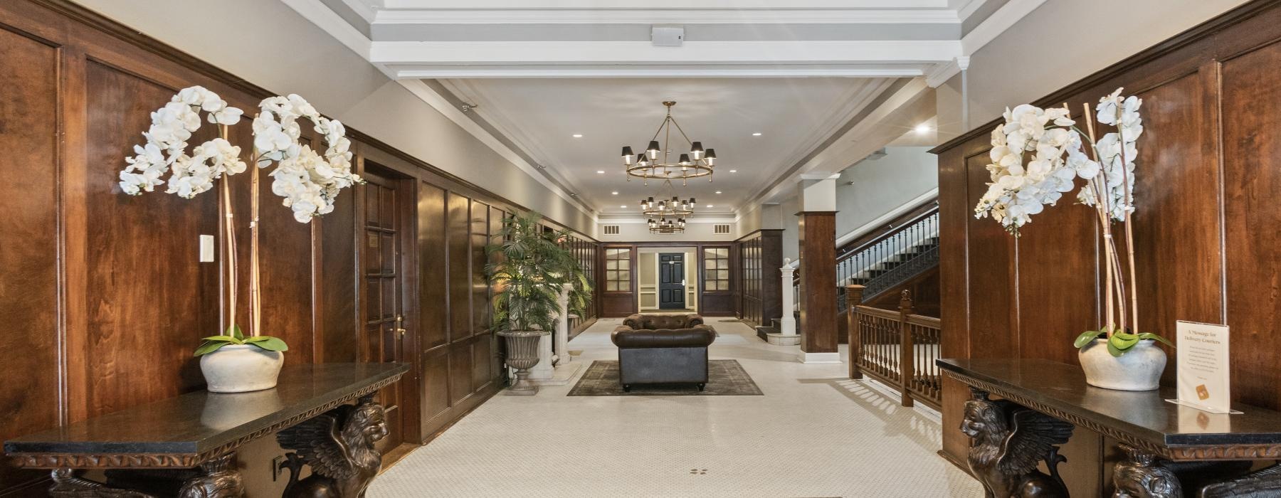 a large room with a chandelier and a couch