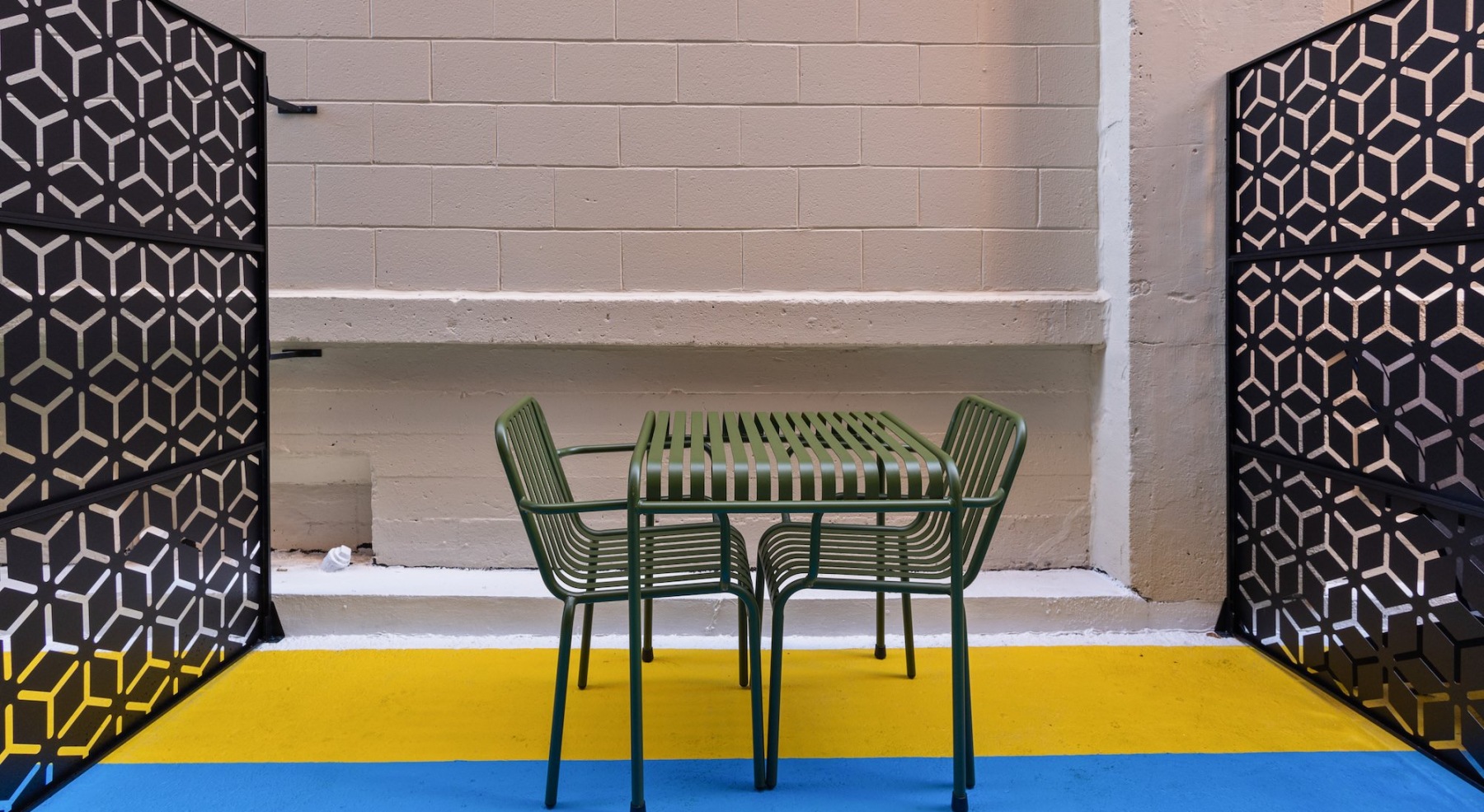 a small card table near a wall