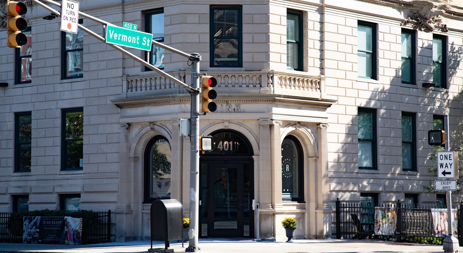 a old building from street level next to an intersection