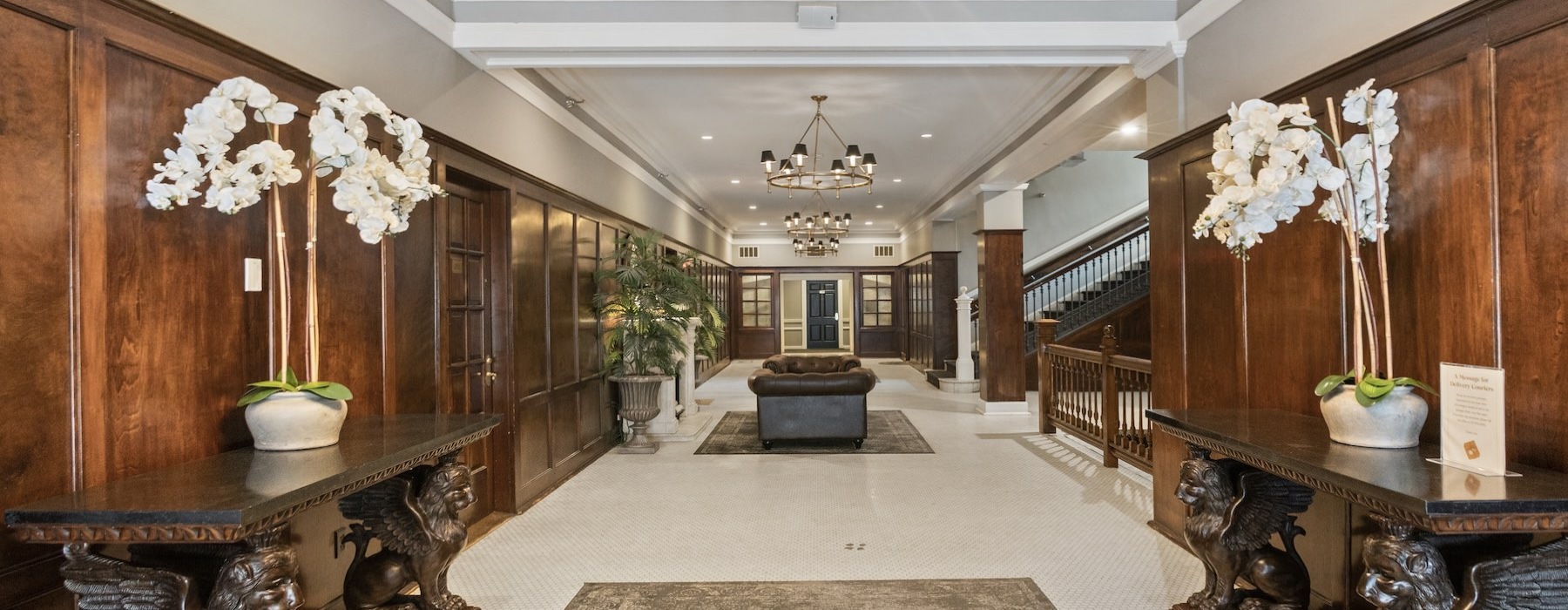 a large room with a chandelier and a couch