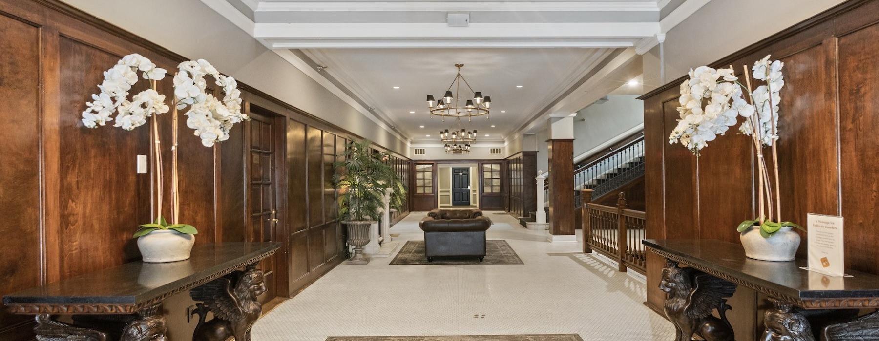 a large room with a chandelier and a couch