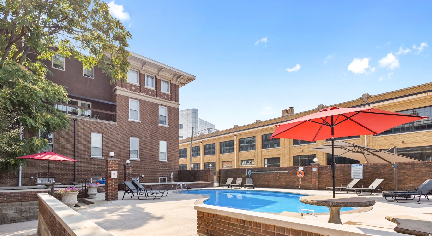 Resort-style swimming pool with lounge seating