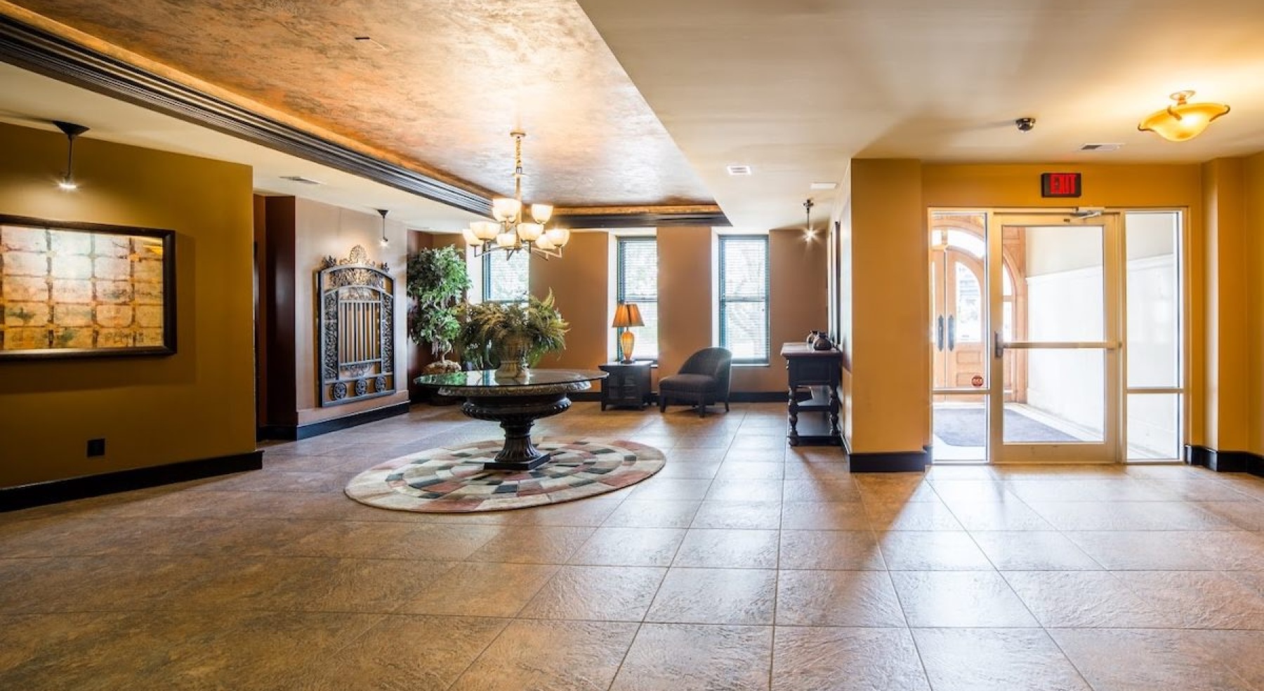 a well-lit lobby with tiled floor